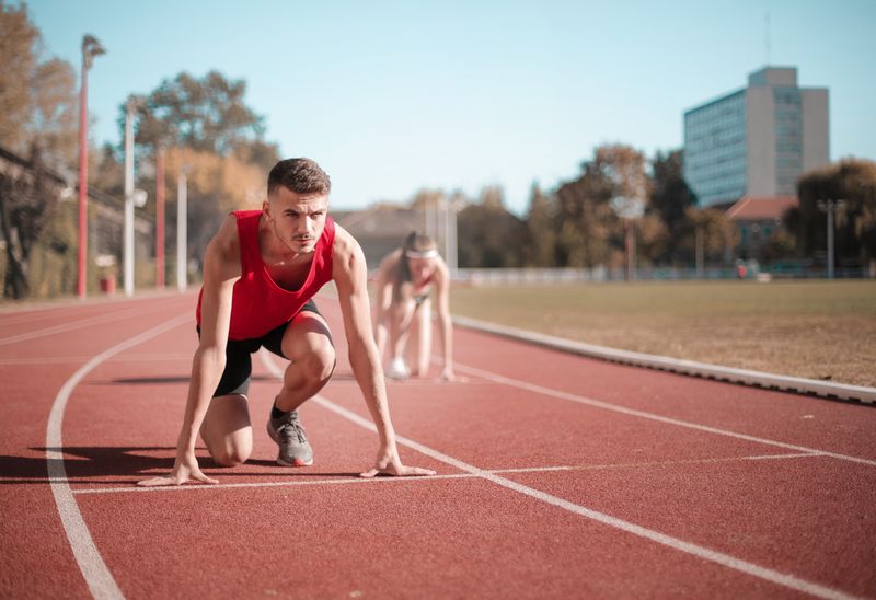 Athlete in starting blocks ready to return to competition